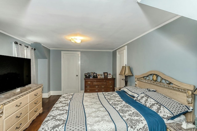 bedroom with baseboards, dark wood-style floors, and ornamental molding