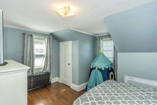 bedroom featuring baseboards, radiator heating unit, dark wood-style flooring, vaulted ceiling, and crown molding