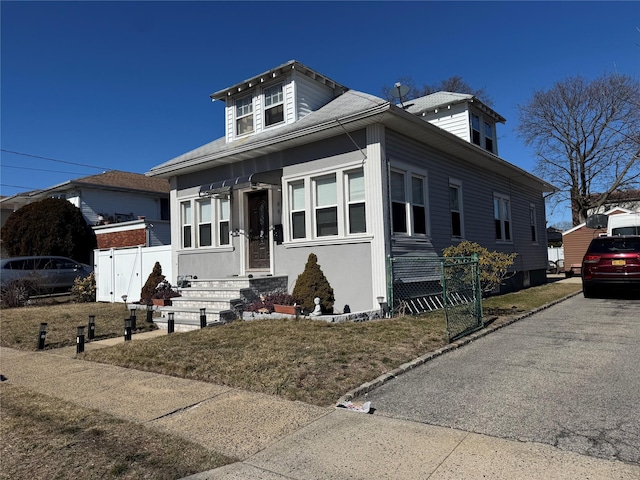 view of front of house with fence