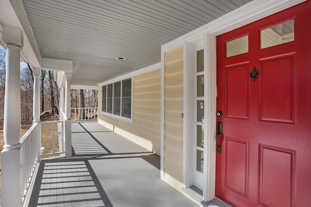 view of exterior entry with a porch