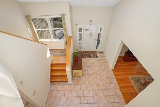 entryway featuring stairway and wood finished floors