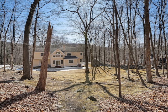 view of front of home featuring a chimney