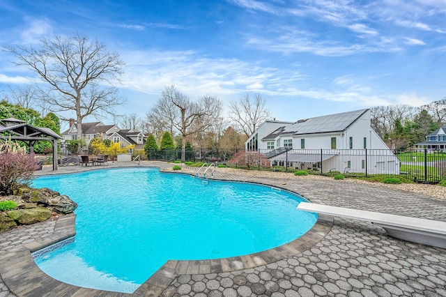 view of swimming pool with a gazebo, a patio area, a fenced in pool, and fence