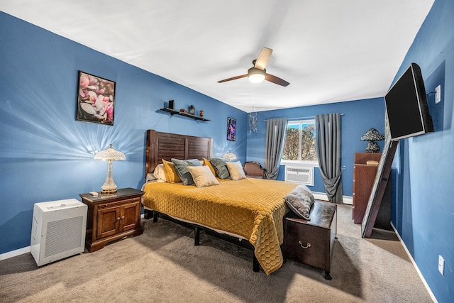 bedroom featuring baseboards, cooling unit, and light colored carpet