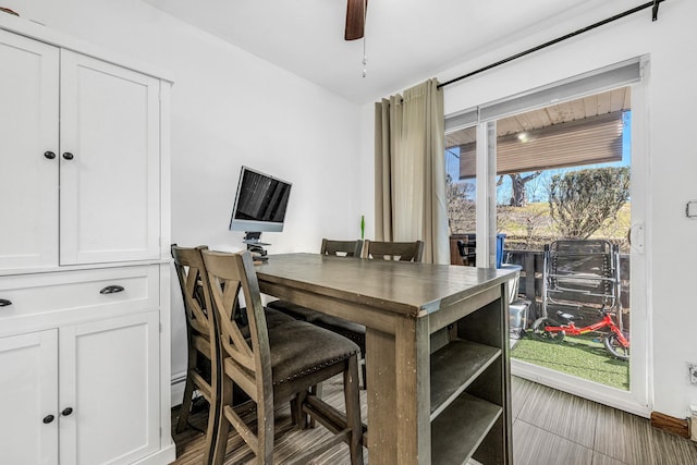 dining space featuring ceiling fan