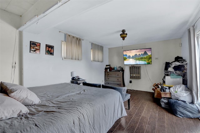 bedroom featuring dark wood finished floors