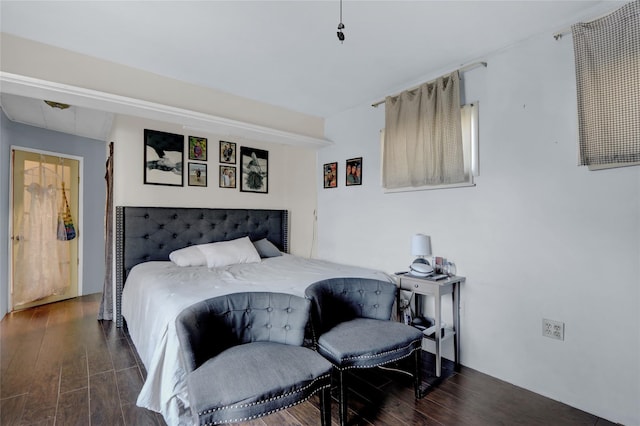 bedroom with wood finished floors