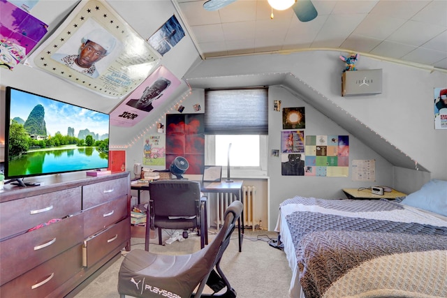 carpeted bedroom with lofted ceiling and radiator heating unit