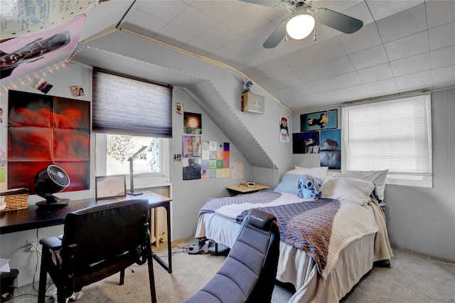 carpeted bedroom featuring a ceiling fan and lofted ceiling