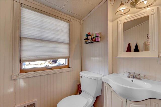 bathroom featuring toilet and vanity