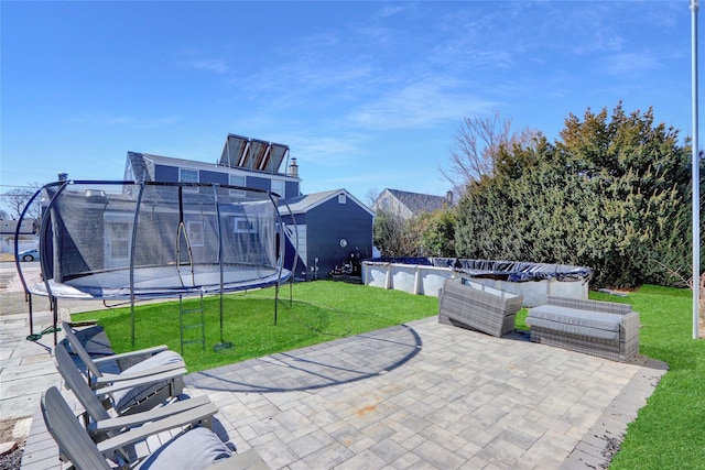 view of patio / terrace with a trampoline and outdoor lounge area