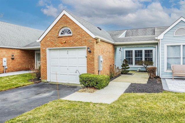 view of front of house featuring driveway, brick siding, an attached garage, and a shingled roof