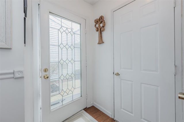 doorway to outside featuring wood finished floors