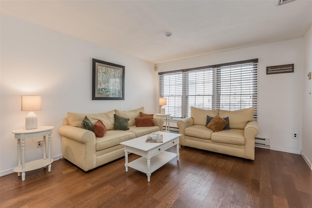 living room featuring baseboard heating, wood finished floors, and baseboards