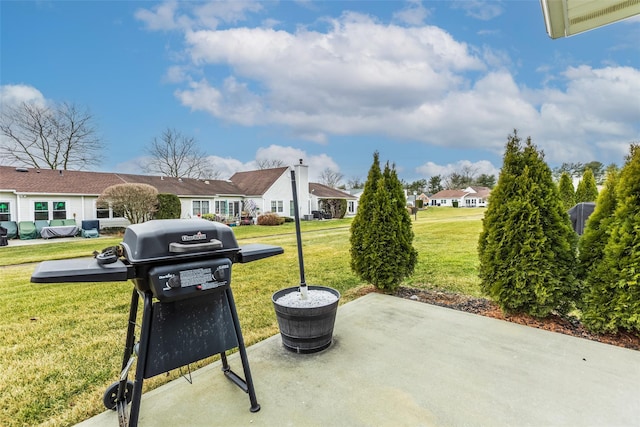 view of patio / terrace featuring a grill and a residential view