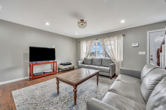 living area with recessed lighting, wood finished floors, and baseboards