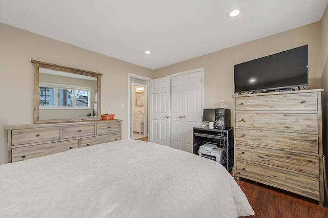 bedroom featuring a closet, dark wood finished floors, and recessed lighting