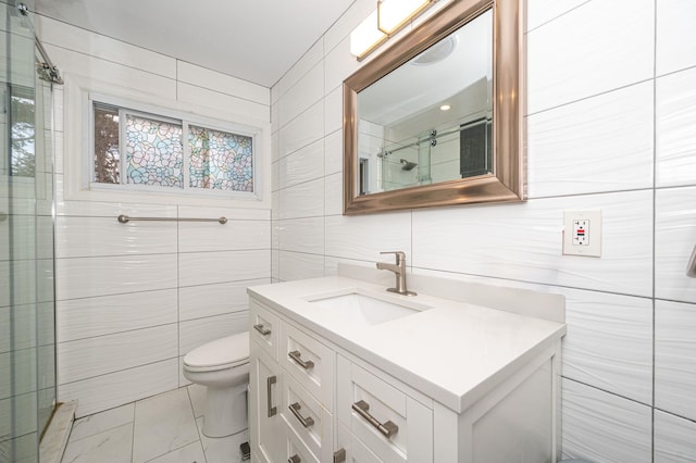 full bathroom with toilet, an enclosed shower, tile walls, and vanity