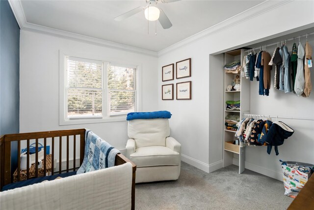 bedroom featuring ornamental molding, carpet, baseboards, and a ceiling fan