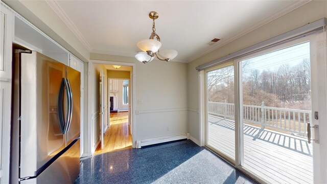 unfurnished dining area featuring a baseboard heating unit, ornamental molding, baseboards, and granite finish floor