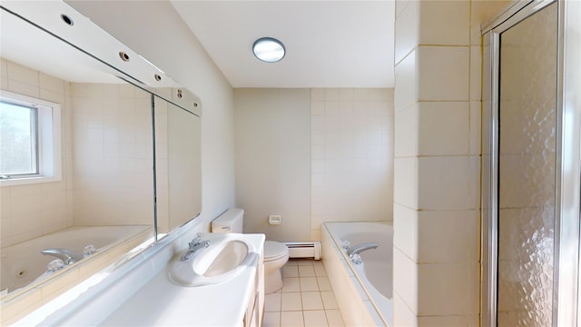 full bathroom with tile patterned flooring, toilet, vanity, a jetted tub, and baseboard heating