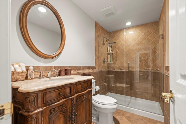 full bathroom with a shower stall, toilet, and tile patterned floors