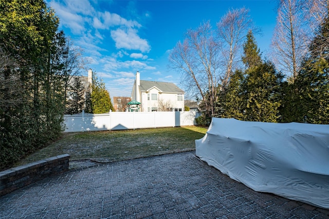 view of yard with a patio area and fence