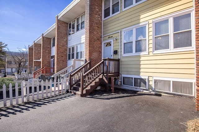 property entrance with fence