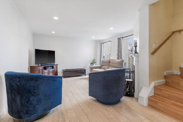 living room with light wood finished floors, stairway, recessed lighting, and ornamental molding