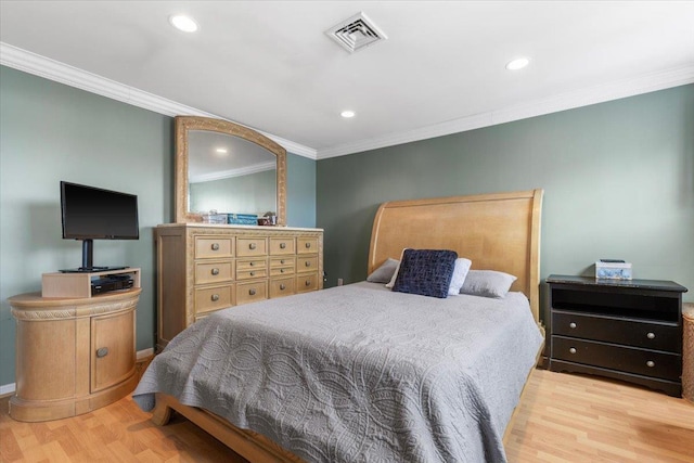 bedroom featuring recessed lighting, wood finished floors, visible vents, and ornamental molding