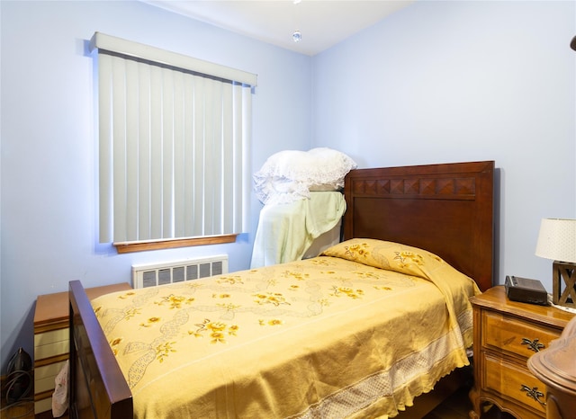 bedroom with radiator heating unit