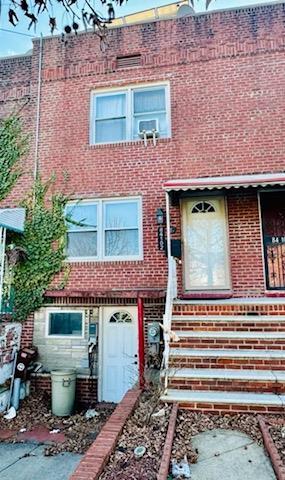 townhome / multi-family property featuring brick siding