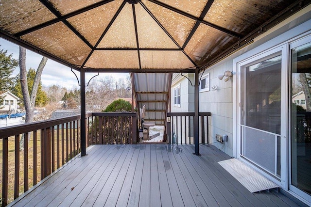 wooden terrace featuring a gazebo