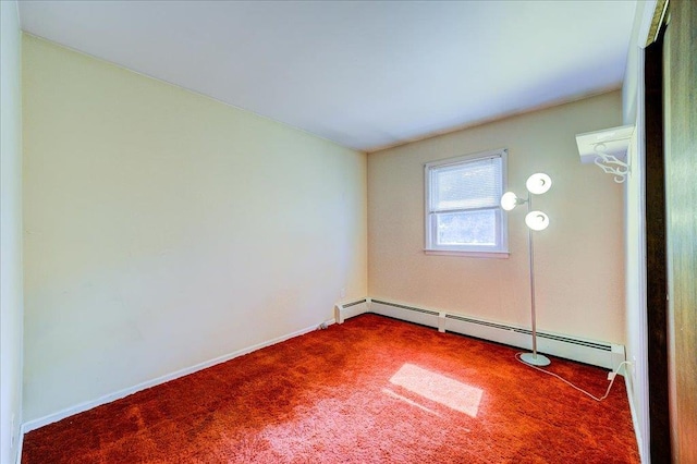 carpeted empty room featuring baseboards and a baseboard radiator