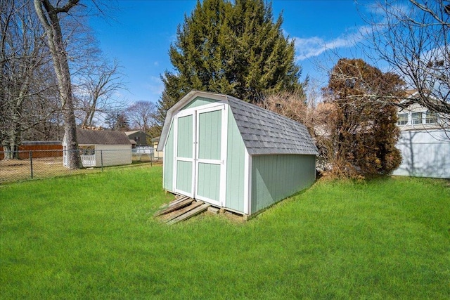 view of shed with fence