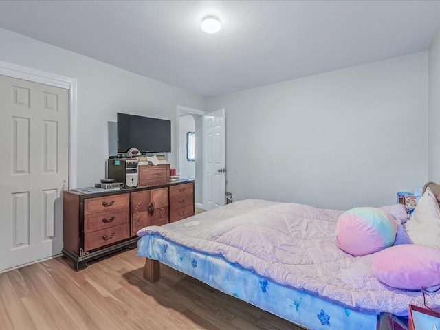 bedroom with light wood-style floors