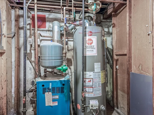 utility room with water heater and a heating unit