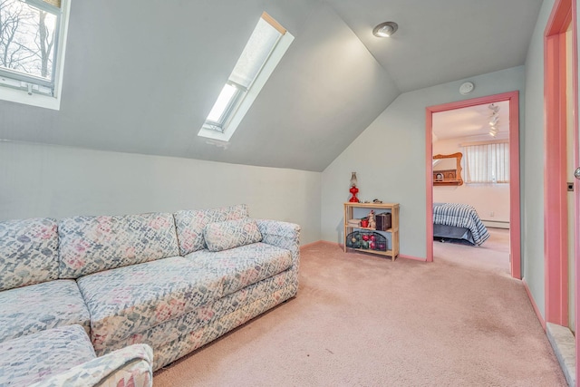 carpeted living room featuring vaulted ceiling with skylight