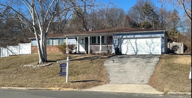 ranch-style house with aphalt driveway, brick siding, a porch, an attached garage, and fence