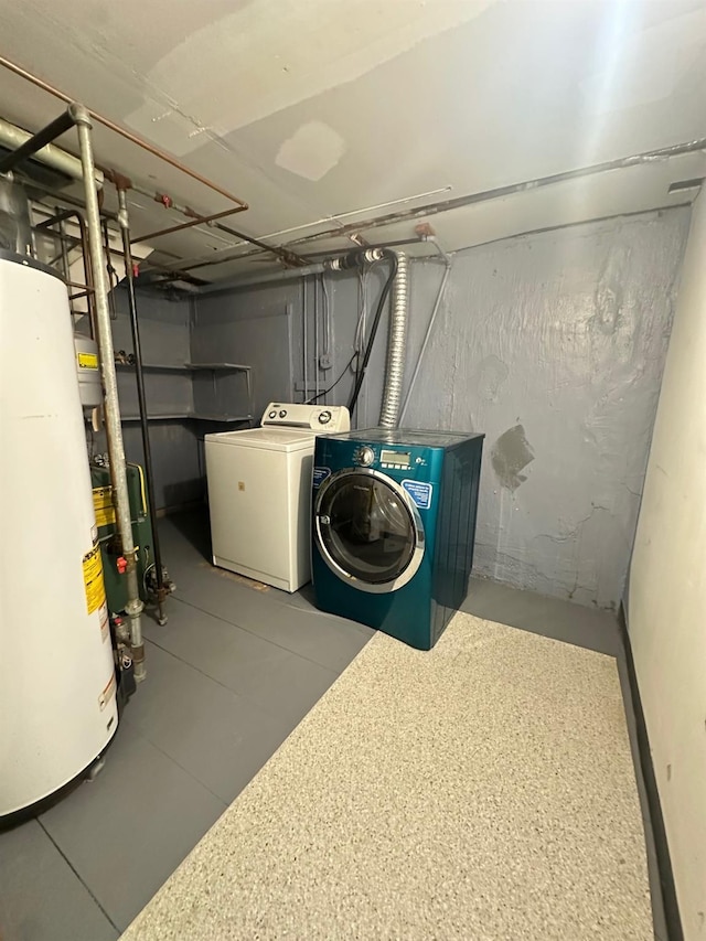 interior space with water heater and washing machine and clothes dryer