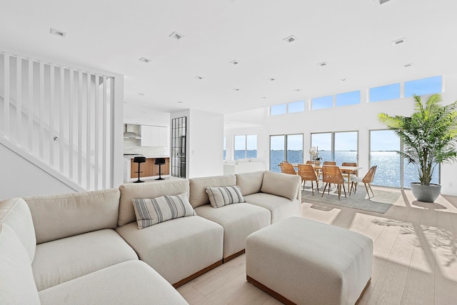 living room featuring visible vents and light wood-type flooring