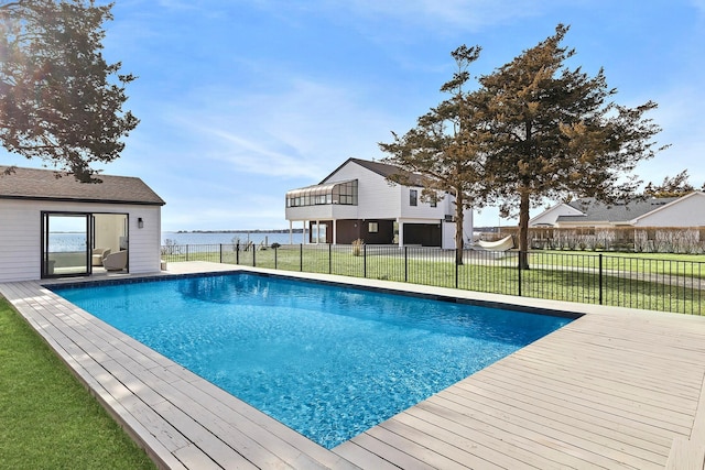 view of pool with a fenced in pool, a water view, a yard, and fence