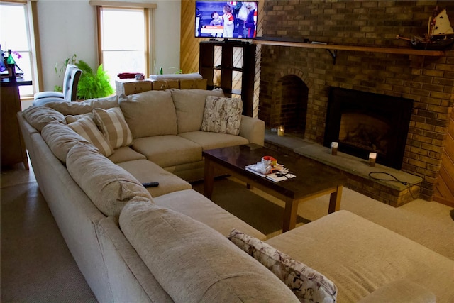 living room with a brick fireplace