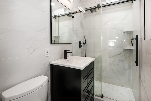 full bathroom featuring vanity, a marble finish shower, toilet, and tile walls