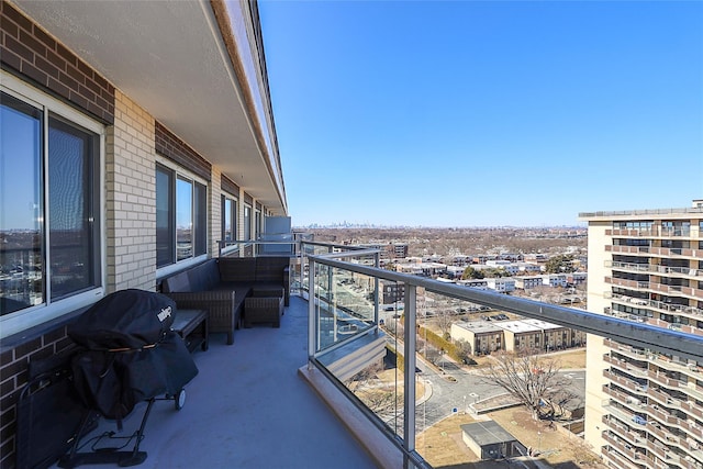 balcony with a city view and grilling area