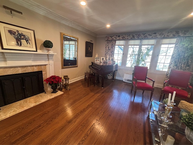 sitting room with recessed lighting, wood-type flooring, a premium fireplace, ornamental molding, and baseboards