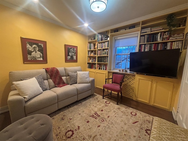 living room featuring crown molding and wood finished floors