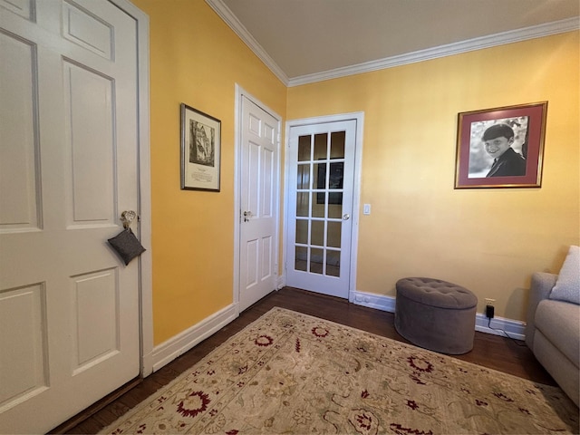 entryway featuring dark wood-type flooring, crown molding, and baseboards