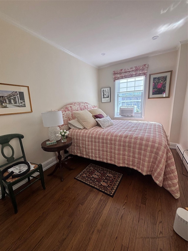 bedroom featuring ornamental molding, cooling unit, wood finished floors, and baseboards