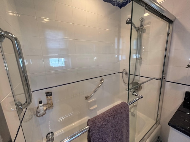 full bath with bath / shower combo with glass door